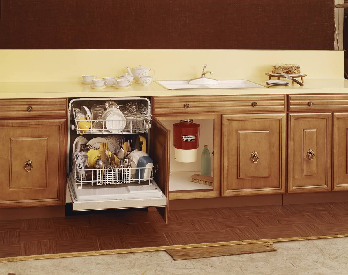 Cleaned utensils in open dishwasher