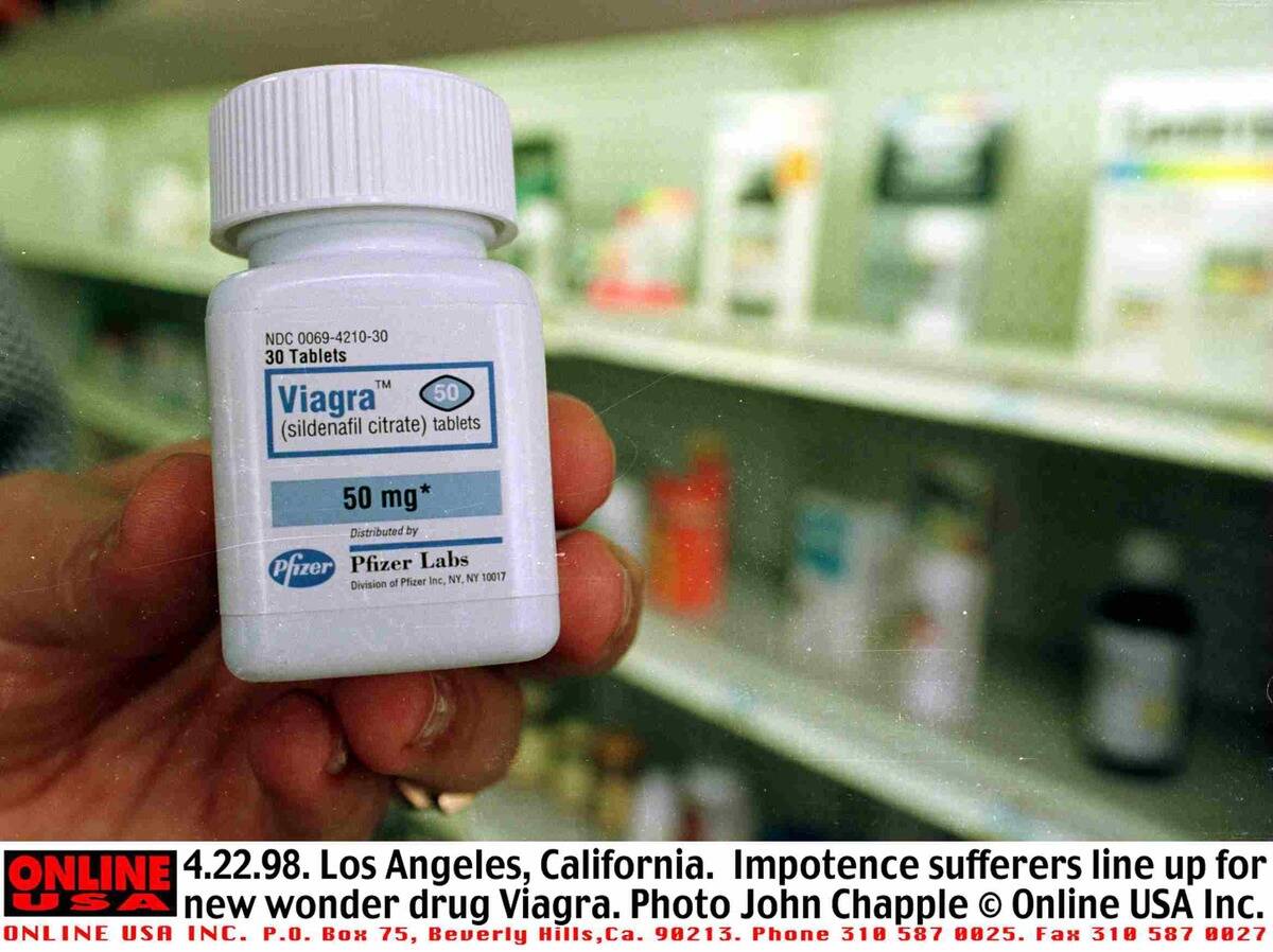 Customer Looks At A Bottle Of The New Wonder Drug Viagra At A Local Drug Store April 22
