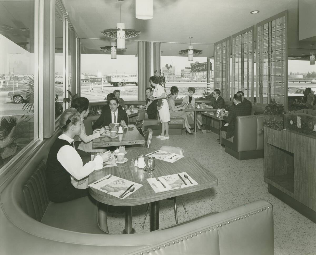Diners inside Denny's Restaurant.