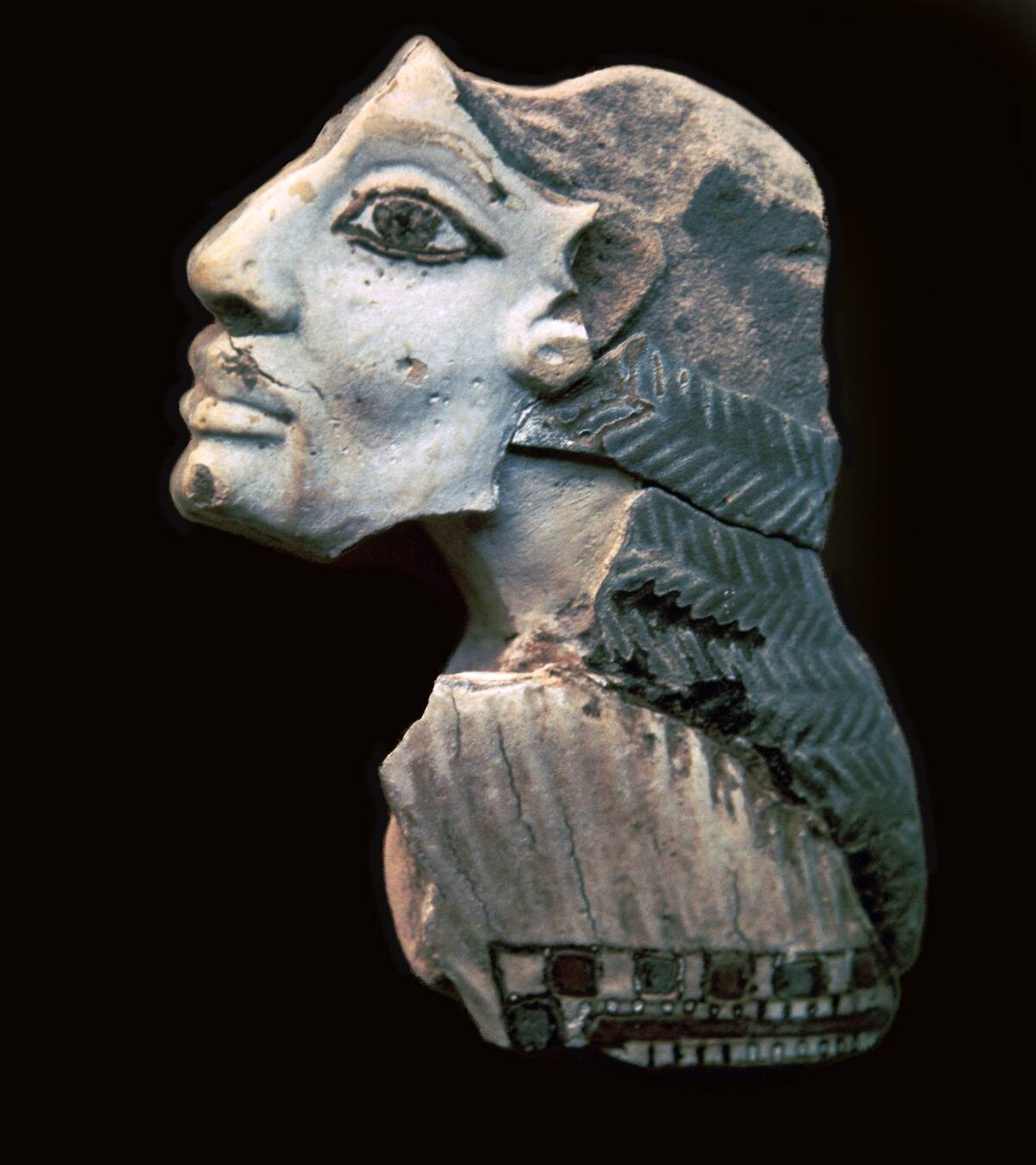 Egyptian glazed relief of a Lybian captive.