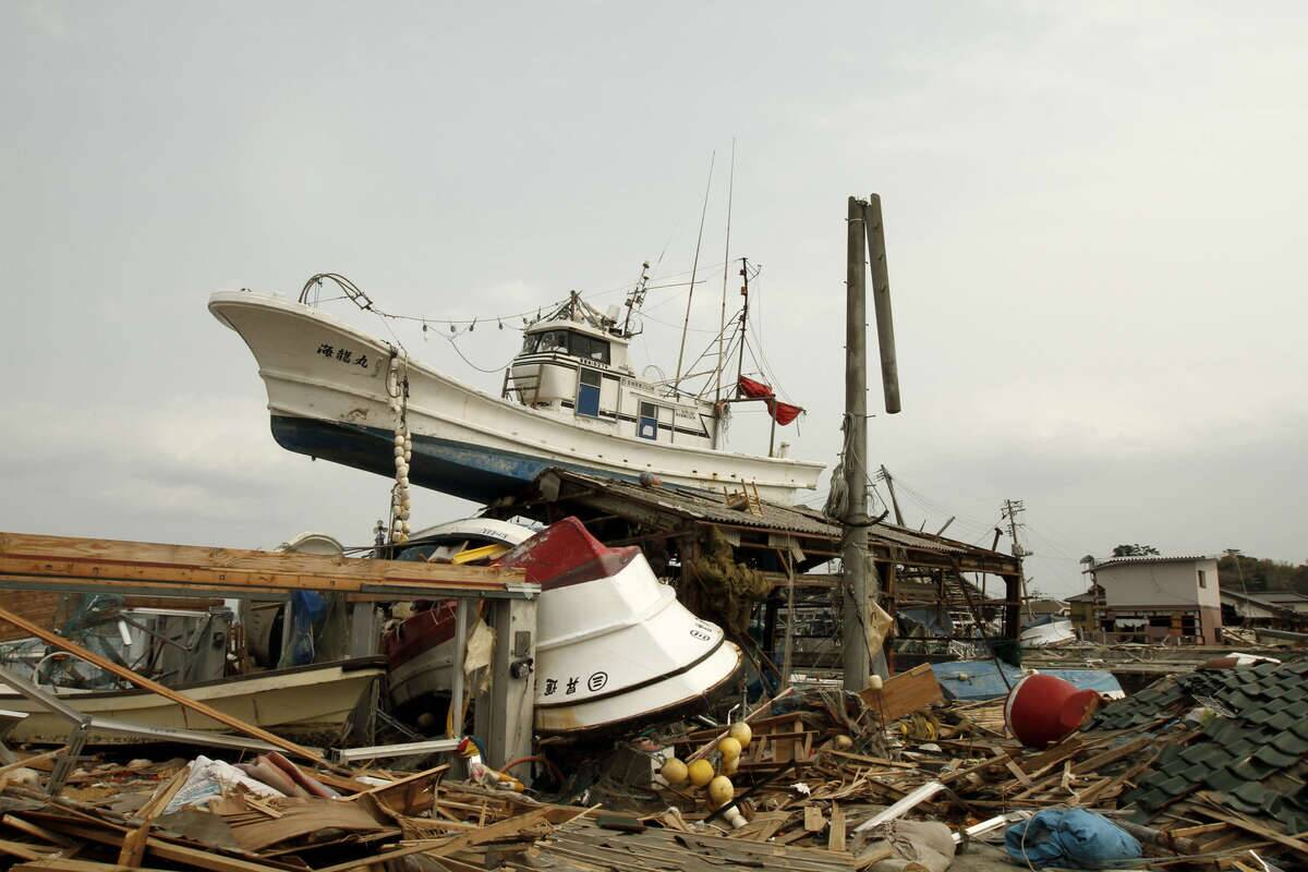 Fishing boats which were destroyed and pushed up on the land