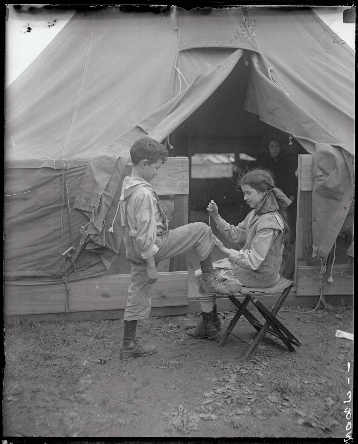Girl Sewing Boys Pant Leg