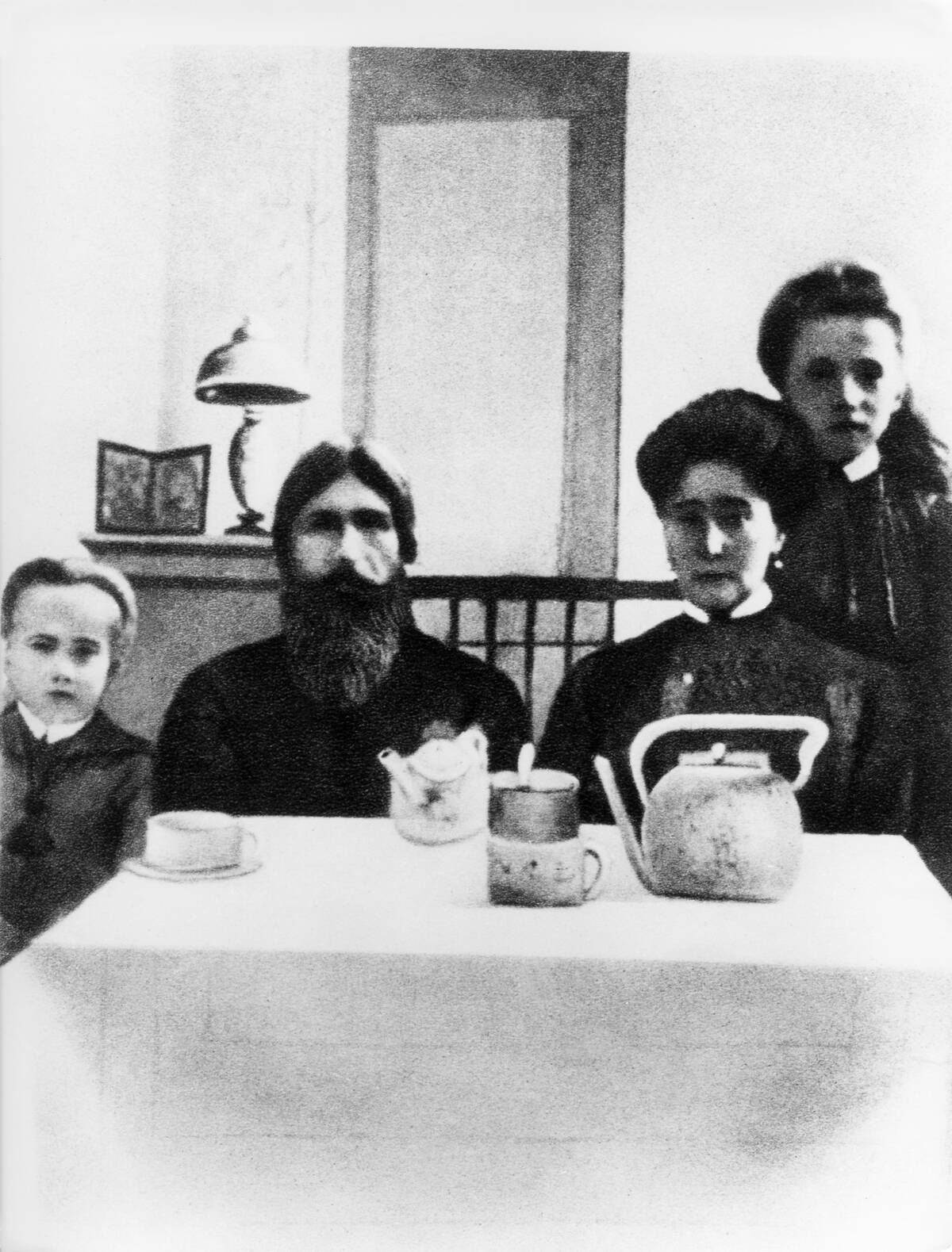 Grigori Rasputin *22.01.1869-30.12.1916+monk, faith healer, Russia - with Tsarina Alexandra Romanov and her son Alexei at the Alexander Palace in St. Petersburg, Russia, 1916.