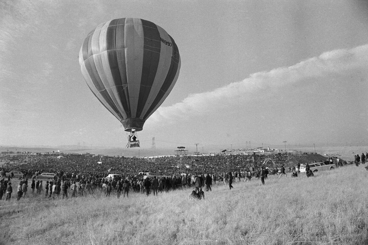 Hot Air Balloon Rising Over Crowd at Altamont Music Festival