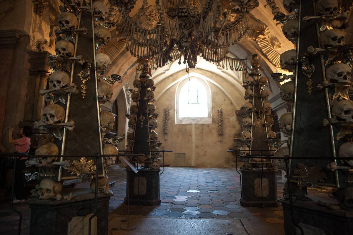 Human skulls and bones in The Bone Church, or Sedlec Ossuary, in Kutna Hora.; Kutna Hora, Czech Republic