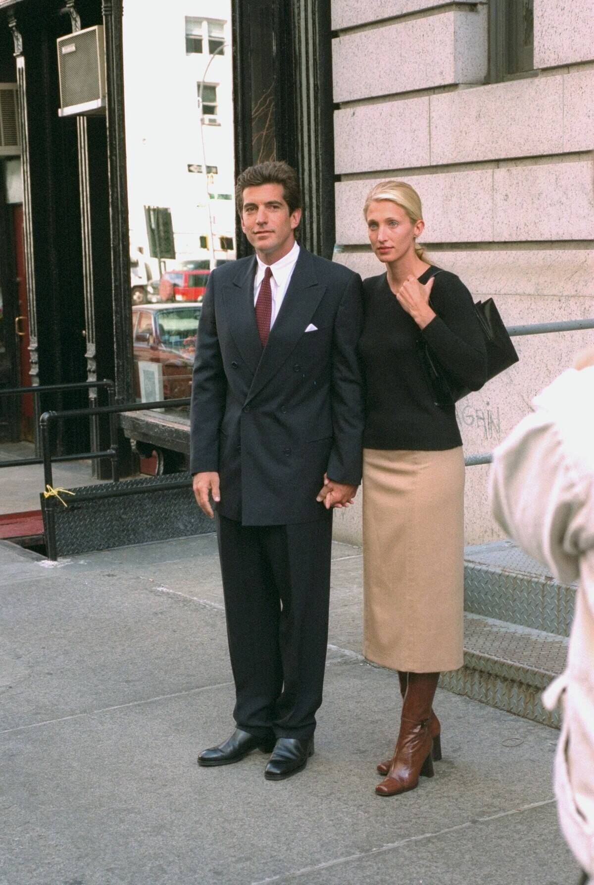 John F. Kennedy Jr. and bride Carolyn Bessette Kennedy stand