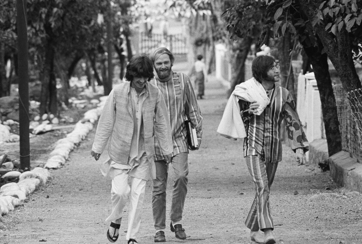 John Lennon with George Harrison and Mike Love Outdoors
