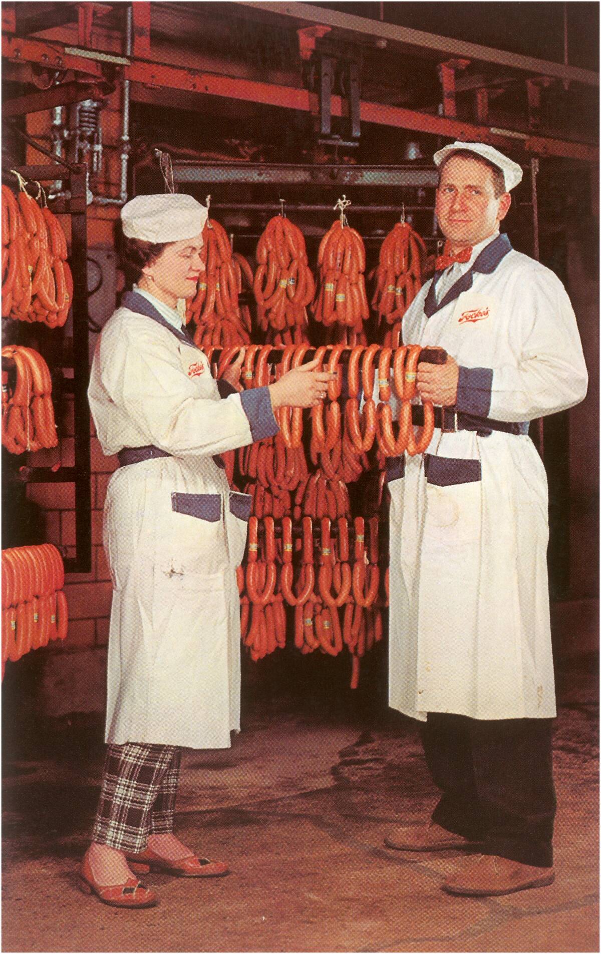 Meatpackers Checking Sausages