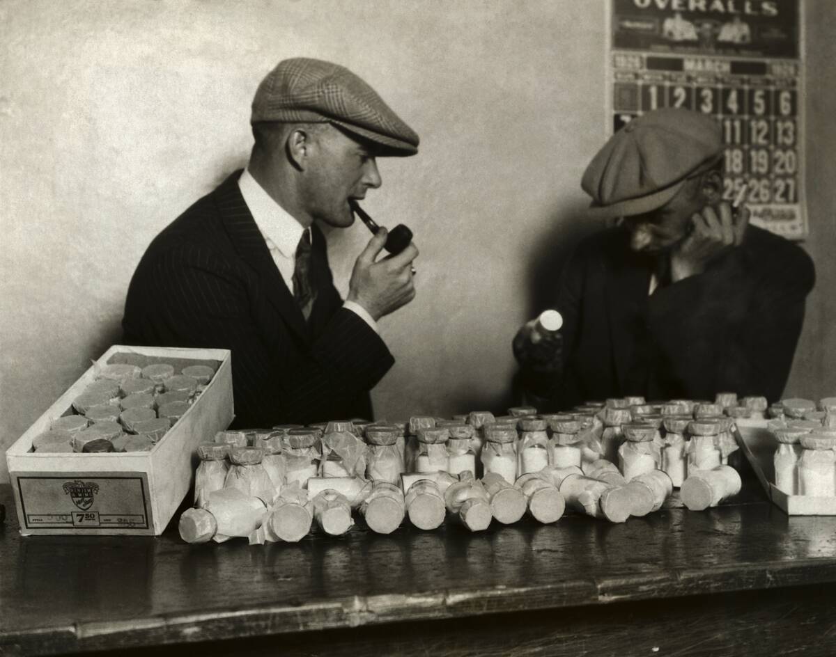Men Examining Bottles of Morphine