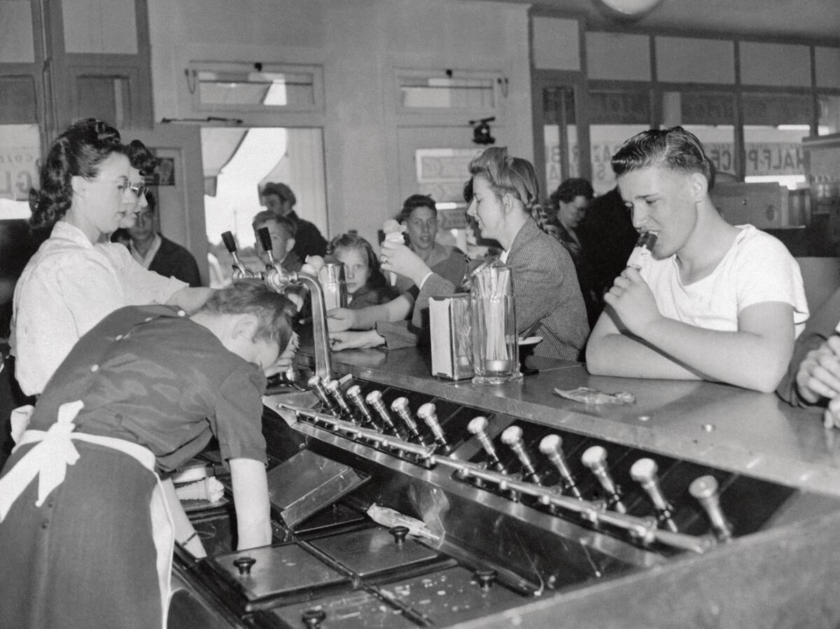 People Having Ice Cream Sodas in Parlor