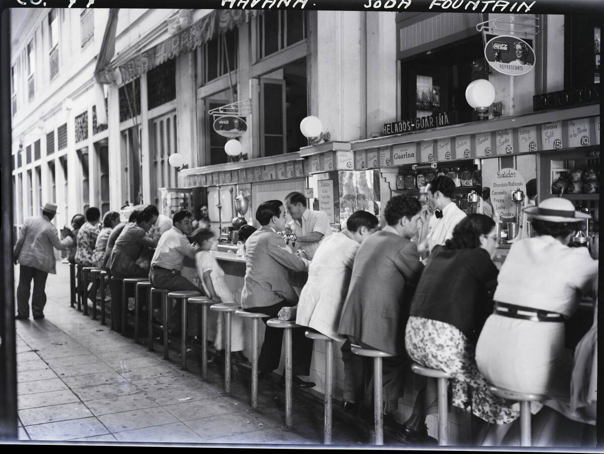 People Seated at a Soda Fountain