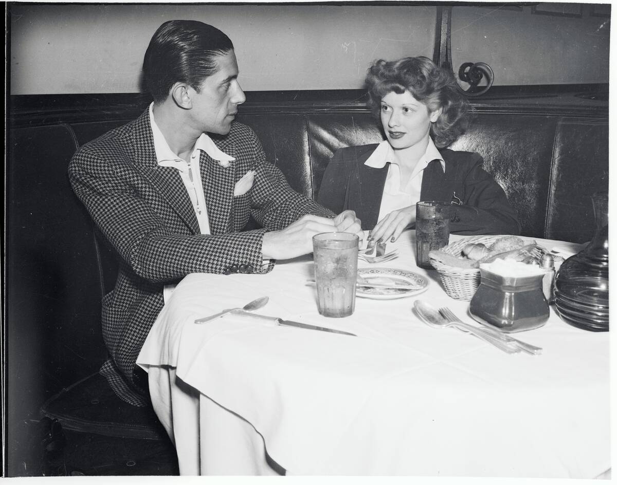 Performer Lucille Ball Sitting at Table With Escort Mack Gray