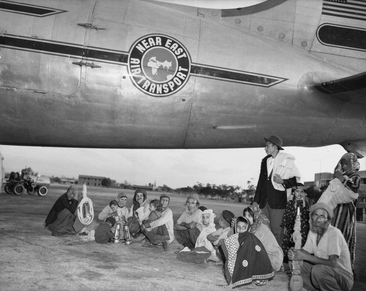 Returning Exiles Sitting by Plane