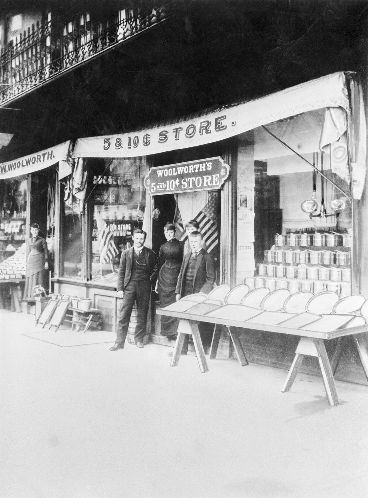 Shopkeepers Stand Outside Of Woolworth'S