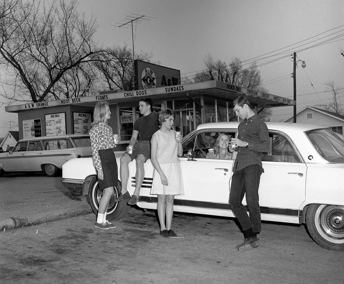 Teenagers Eating At Drive-In Diner