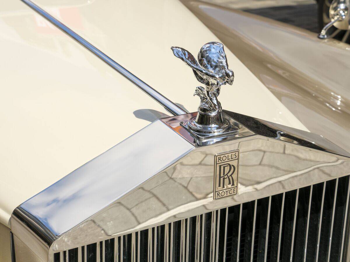 The Spirit of Ecstasy mascot sculpture on the bonnet of a Rolls-Royce car