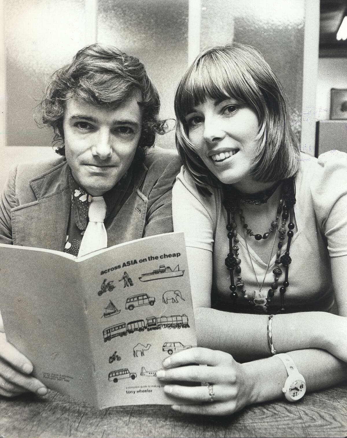 Travel authors Tony and Maureen Wheeler with their book 'Across Asia on the Cheap'