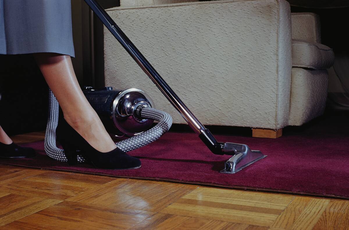 Woman Vacuuming Rug