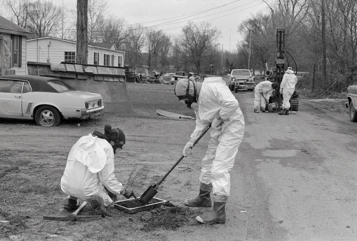 Workers Sifting Soil for Toxins