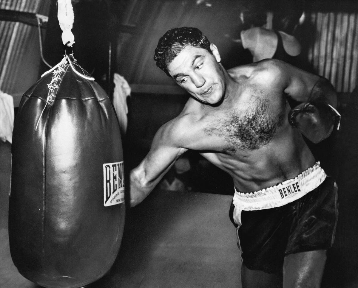 Boxer Rocky Marciano Practices on Punching Bag