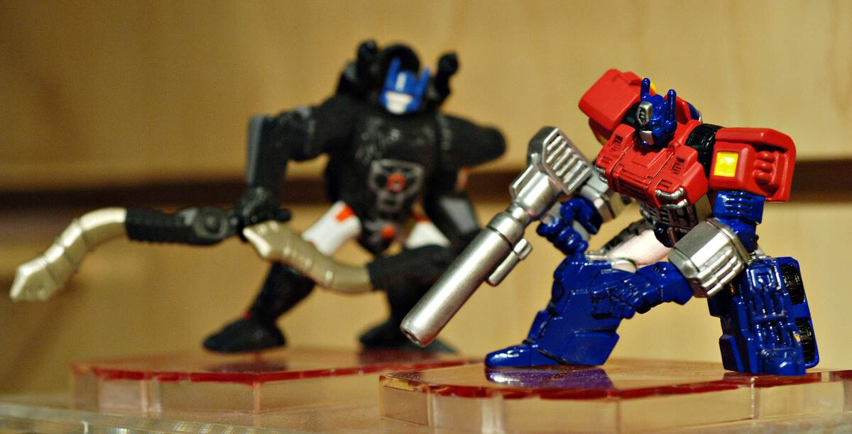 Die-cast collectors edition Transformer figures sit on displ
