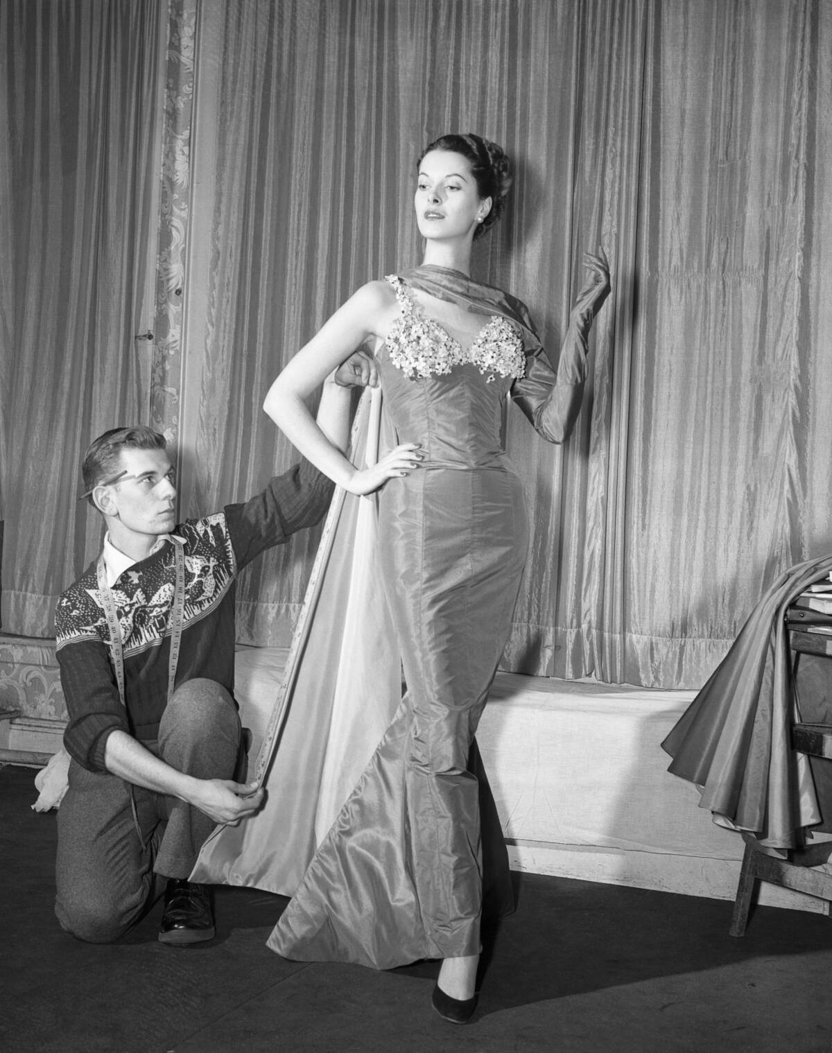 Man taking measure for dress