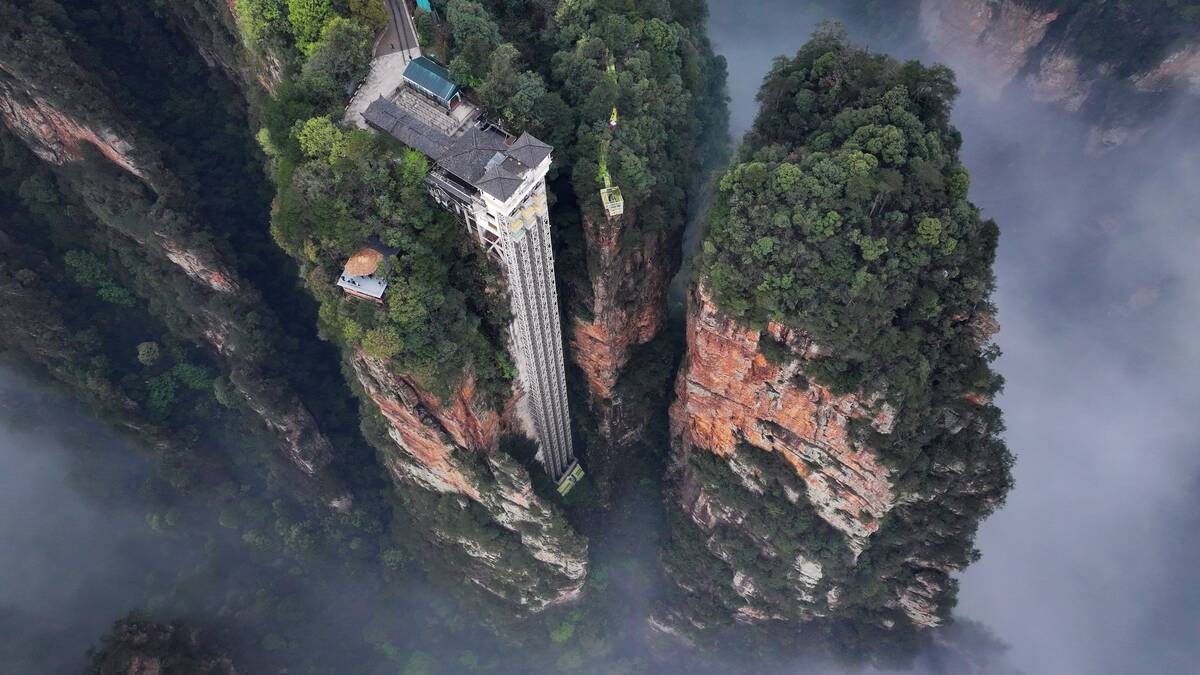 Mist And Clouds Shroud Bailong Elevator In Zhangjiajie