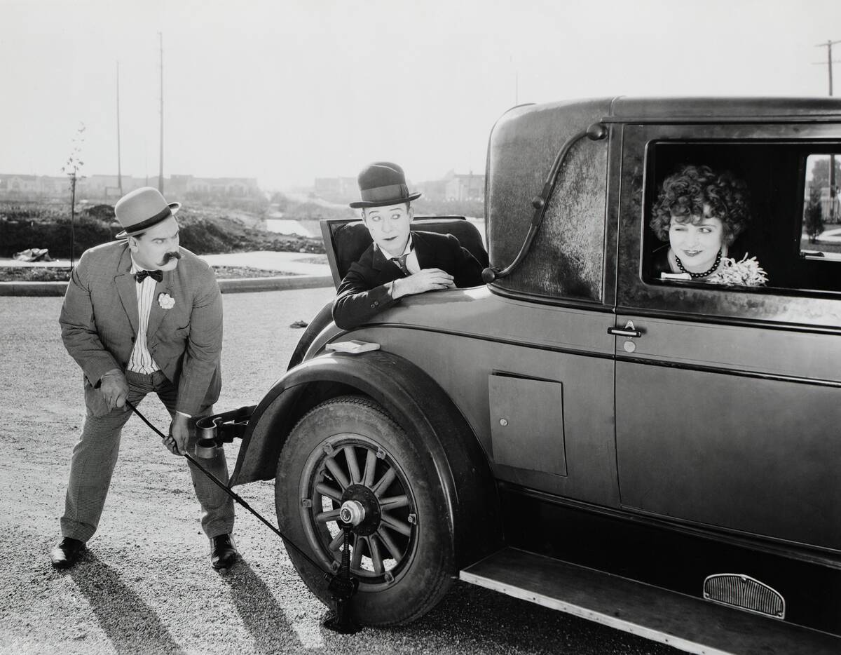 Movie Still;Changing Tire,Using Jack