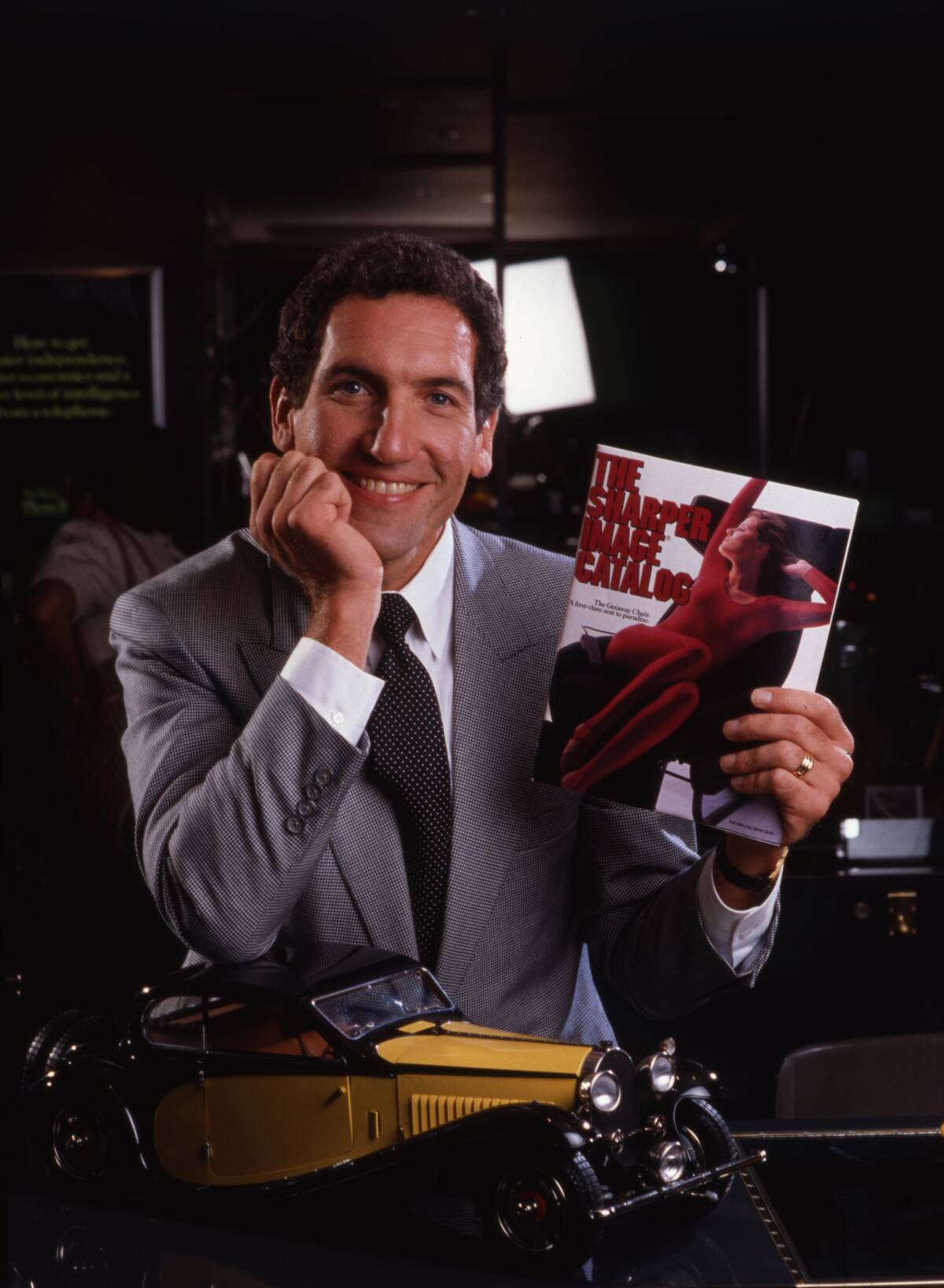 Richard Thalheimer Holding Sharper Image Catalog