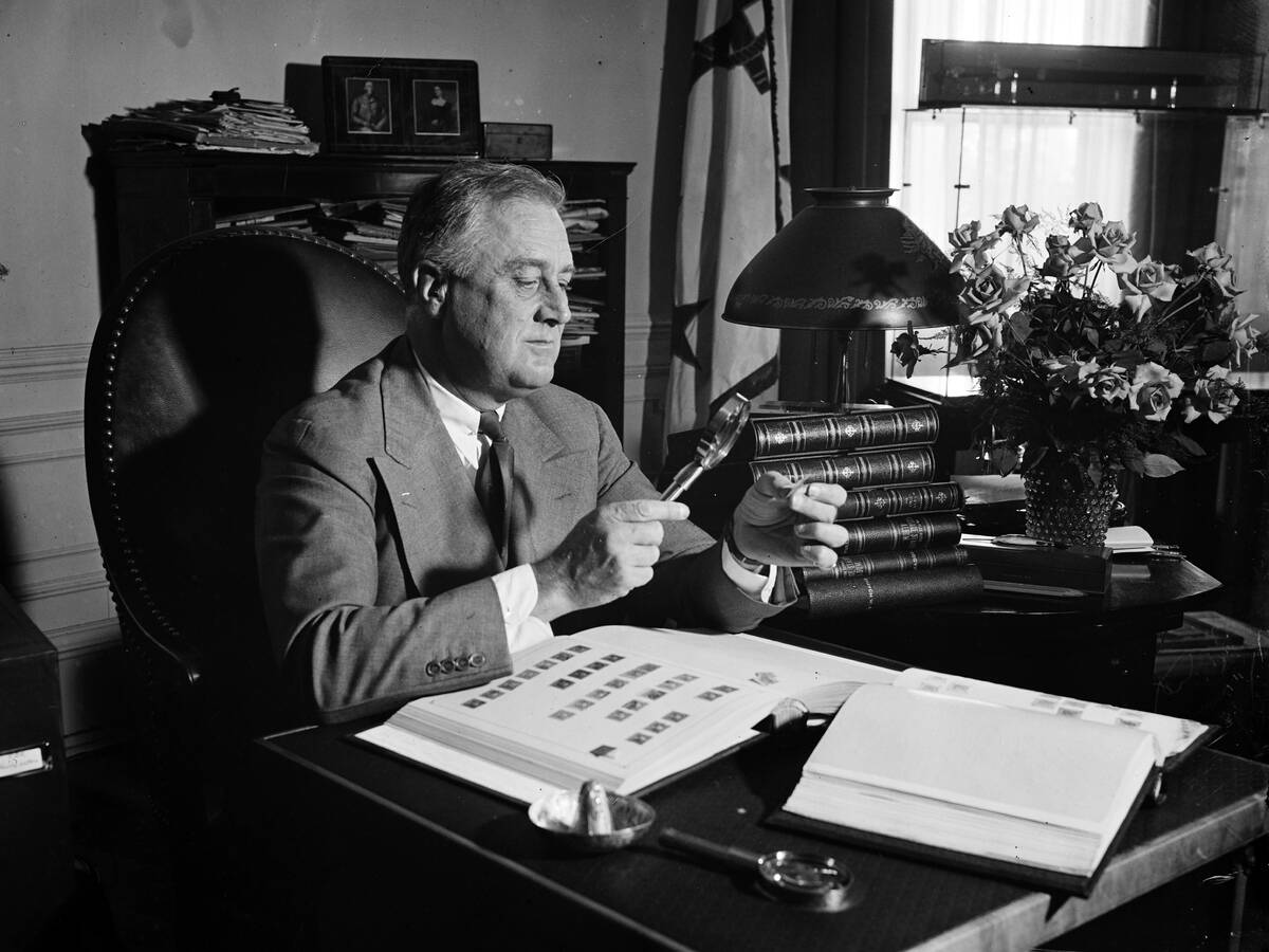 Roosevelt Looking At Stamps