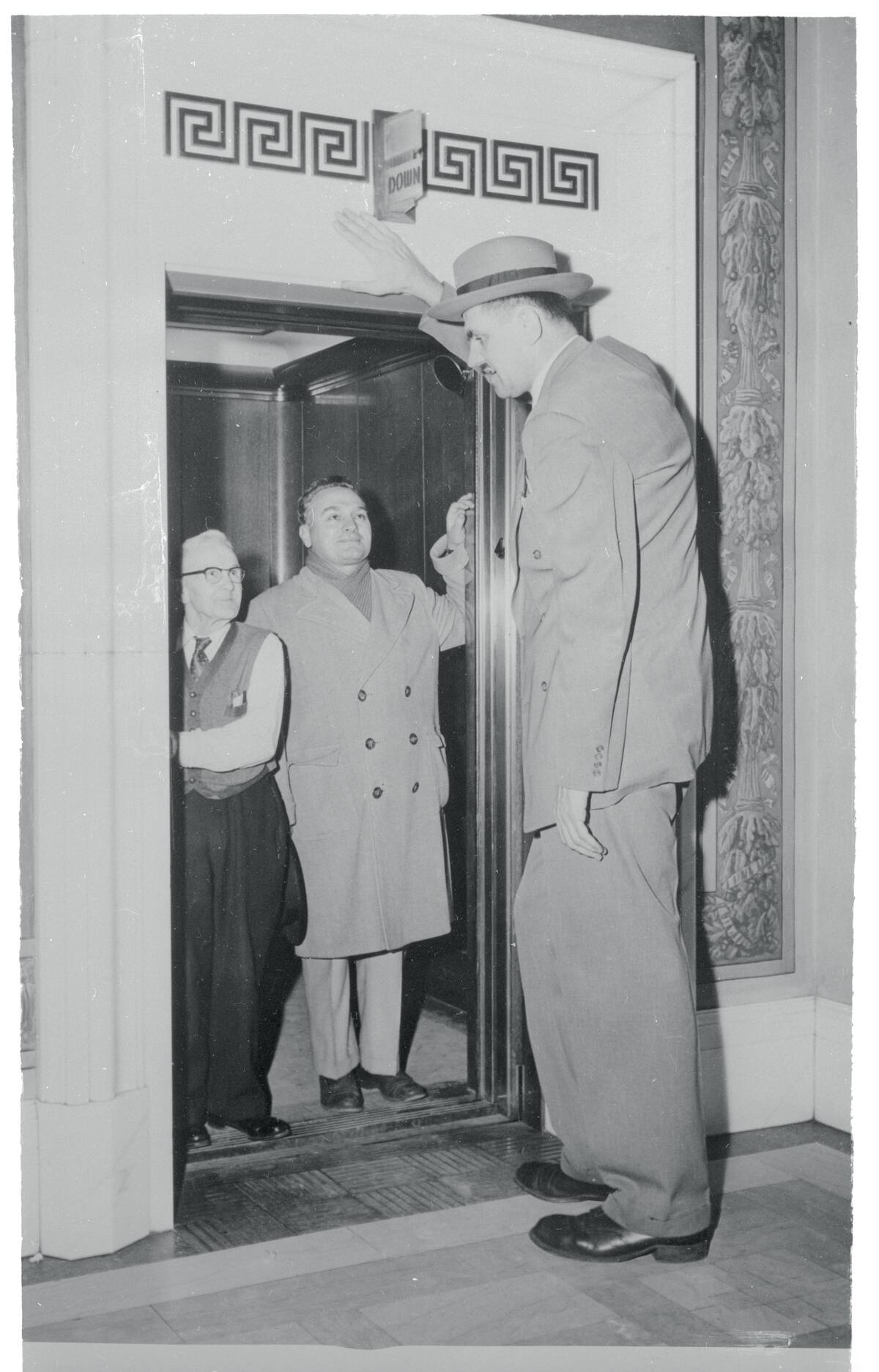 Tallest Man Entering Elevator