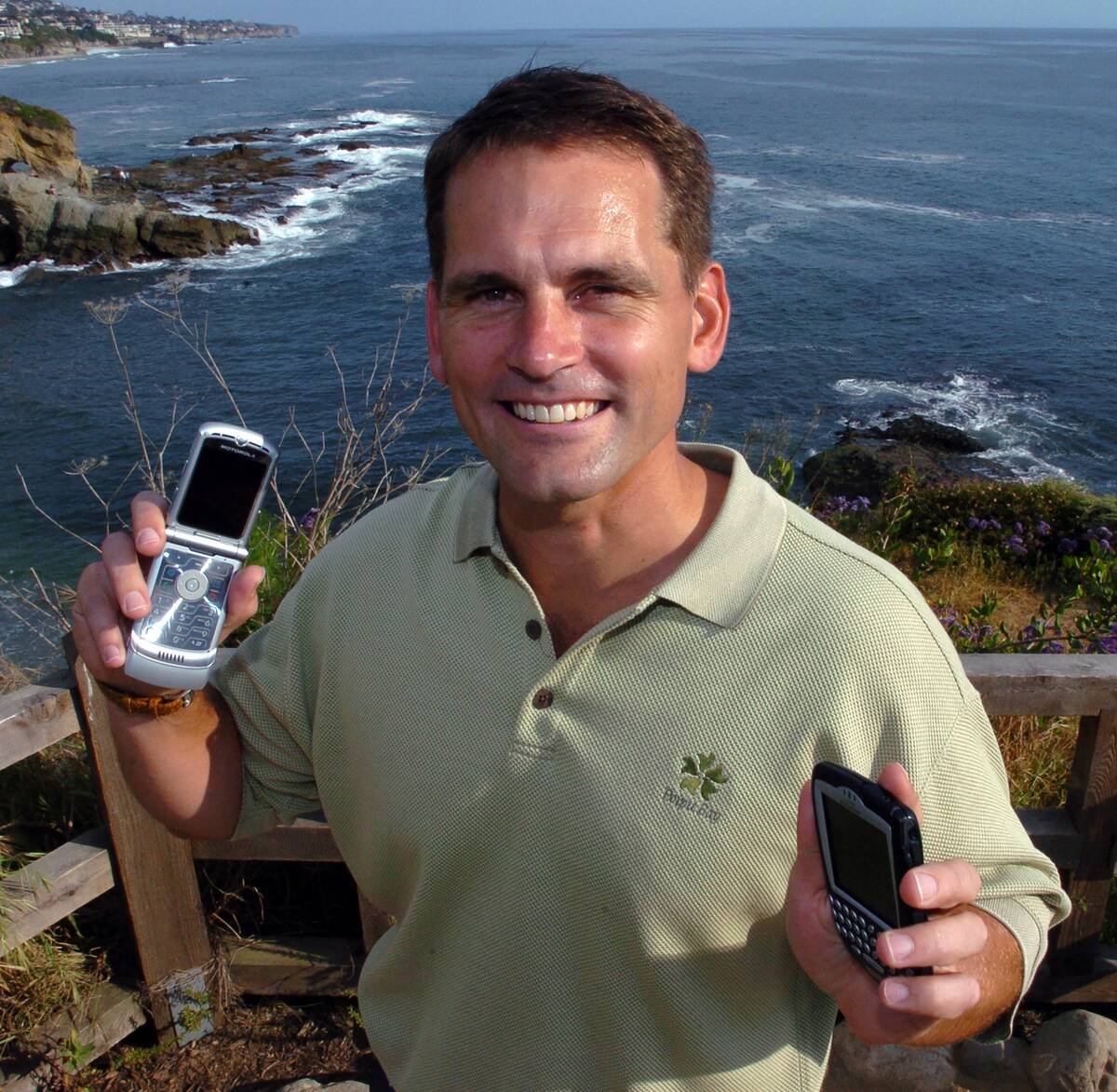 Traveler Uses Cellphone And BlackBerry