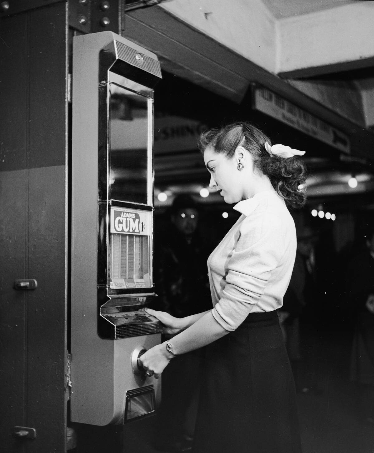 Woman Buys Gum From Vending Machine