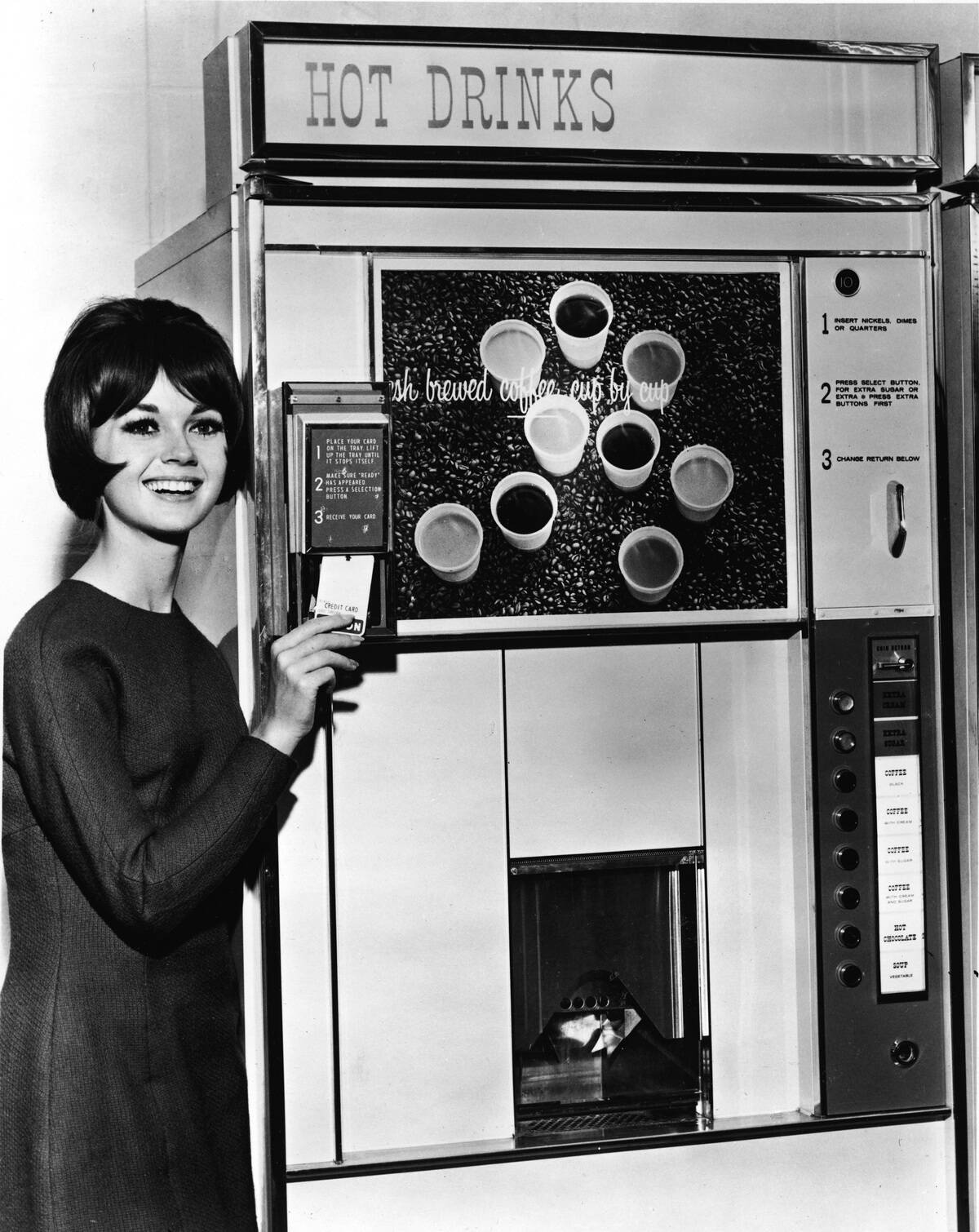 Woman Demonstrates Coffee Vending Machine